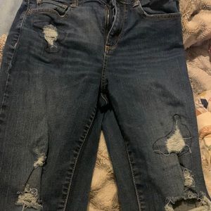 Ripped blue jeans pants